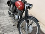 a motorcycle that is parked on the side of the street