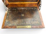an old wooden box with a metal handle on it