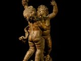 an image of a statue of a boy and a girl on a horse
