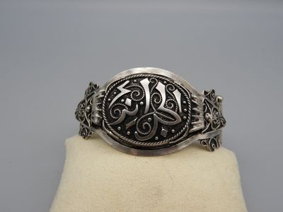 Bracelet en argent 800 articulé à clavette orné de motifs fl…
