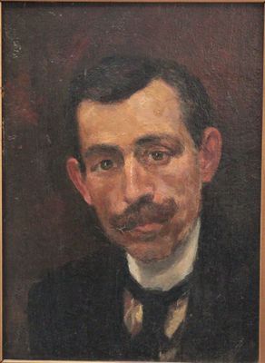 portrait of a man with a mustache in a black suit and bow tie