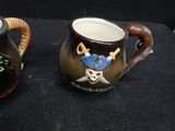 two mugs that are sitting next to each other on a table