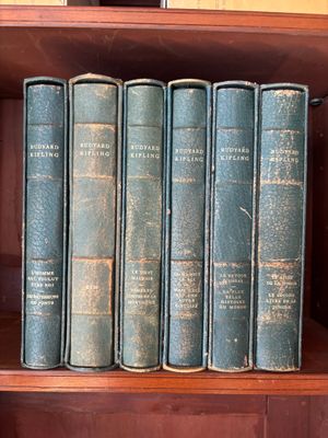 many books on a shelf in a book case