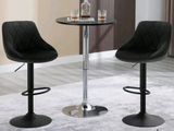 two black chairs and a table in a room