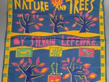 a close up of a blue and yellow banner with trees on it