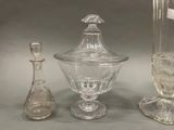 three glass vases sitting next to each other on a table