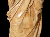 an antique statue of a man with a beard and a robe