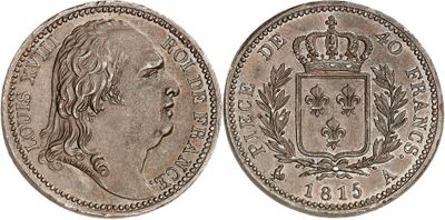 a silver coin with a crown on top of it