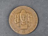 an image of a gold coin with a woman ' s face and three men ' s heads on it