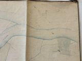 a drawing of a map in a book on a table