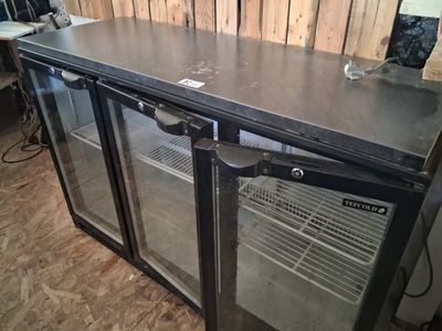 an image of a stainless steel counter top with a glass door