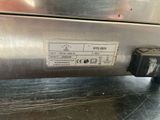 an image of a stainless steel dishwasher with a label on it