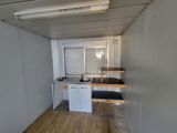 a small kitchen with a sink and a window in it