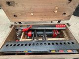 a tool box with tools inside of it on the ground