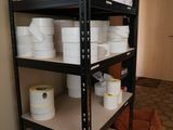 many rolls of toilet paper on the shelves in the room