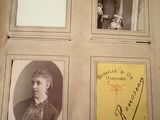 an old photo of a book with pictures of people on it