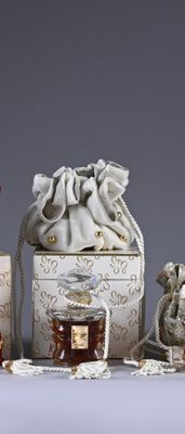 a small bag with a drawstring on it next to other items