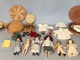 a lot of dolls that are sitting on a table