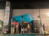many different types of electronic devices on a shelf