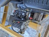 a picture of a close up of the engine of a construction vehicle