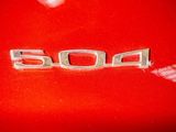 a close up of a red car with the word 5004 written on it