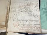 many old papers that are on a table