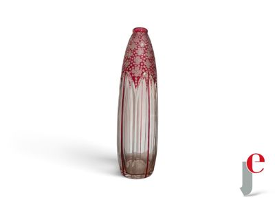 a glass vase with a red design on it