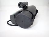an image of a black telephone on a white surface