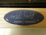 a blue sign that says medi ford on the side of a building