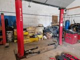 a garage with a lot of tools and tools on the floor