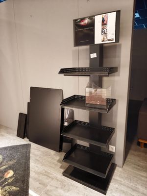 a black shelf that has a bunch of items on it