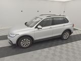 the white volkswagen suv is parked in the garage