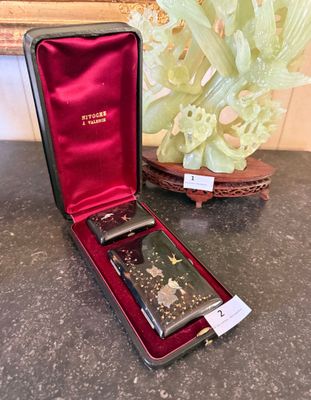 a case with a watch inside of it on a table