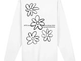 a white long - sleeved t - shirt with black and white flowers on it