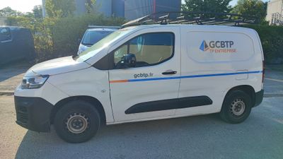 a white van that is parked in a parking lot