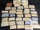 a lot of old letters on a black table