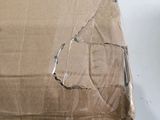 a cardboard box with a hole in it on a table