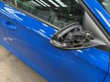 a close up of a car ' s door handle and door handle