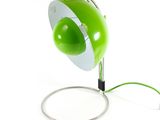 a close up of a green lamp with a wire