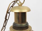 a close up of a lamp with a chain on it