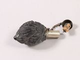 an image of a necklace with a bear head on it