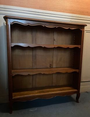 an image of a wooden bookcase with a shelf on top of it