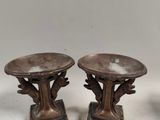 pair of antique bronze candlesticks on marble bases
