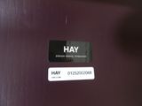 a sticker that says hay on the side of a refrigerator