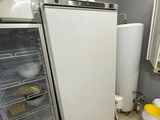 a refrigerator and freezer in a small room