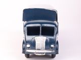 a blue toy truck that is sitting on a white surface