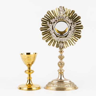 an image of a golden chalicet and a gold cup on a white background