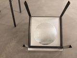 a chair that has a hole in the back of it