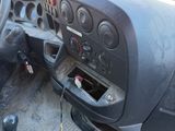 a dashboard of a truck with a steering wheel and dash panel