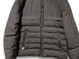 a picture of a jacket with a hood and zippers